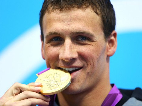 Olympian Biting Gold Medal